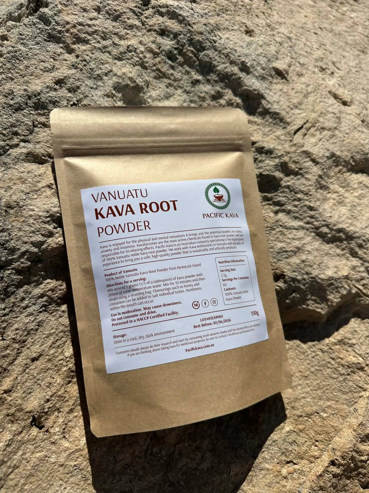 Borogoru kava powder pouch resting on coastal rocks