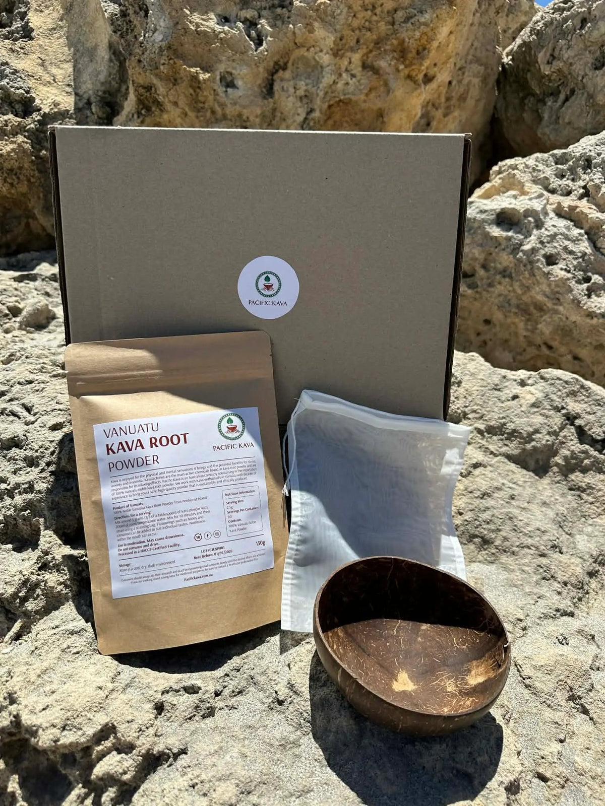 Kava Starter Pack box with pouch and coconut cup on rocks