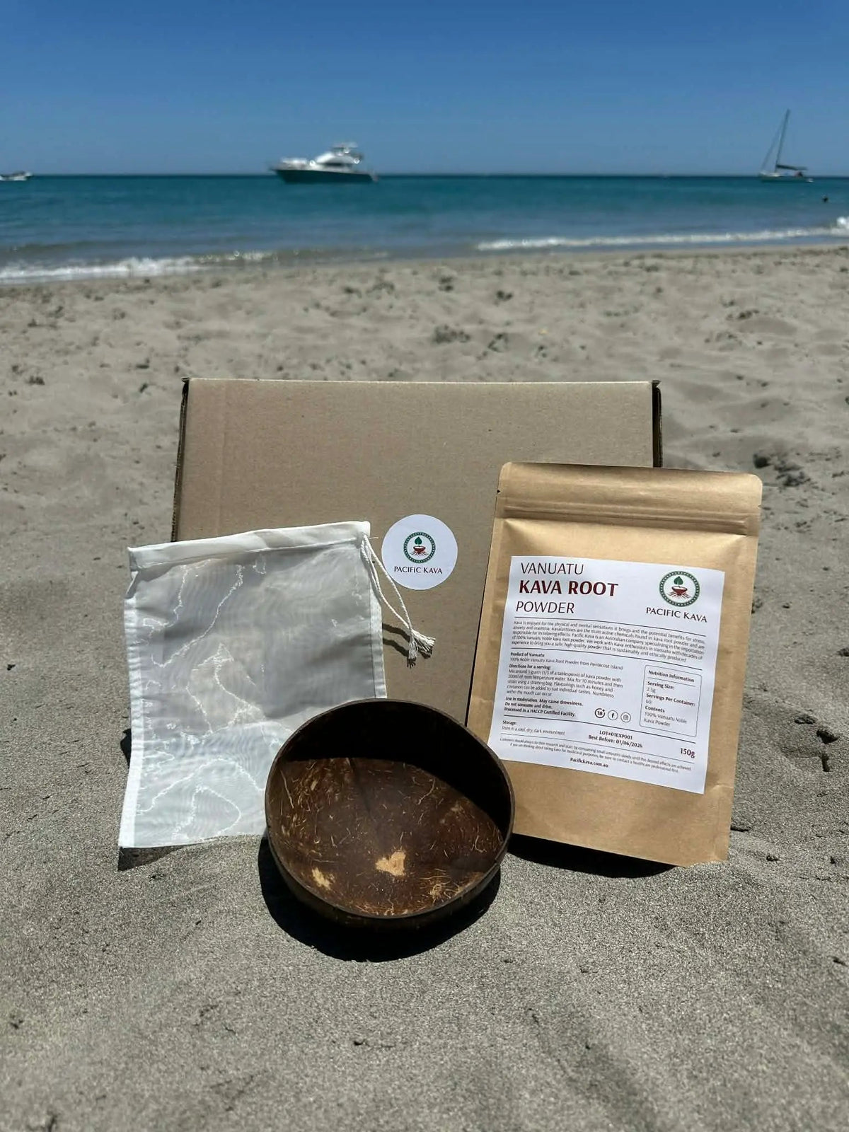 Kava Starter Pack box, pouch and coconut cup on a beach